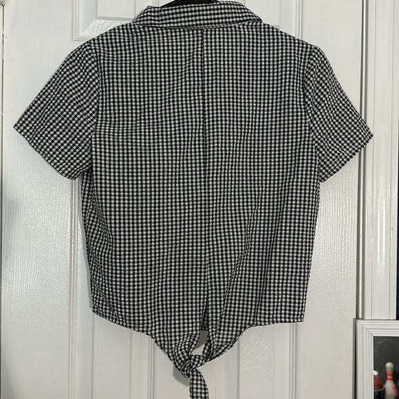 Cute black and white plaid button down with and low toe at the back. - Picture 3 of 3